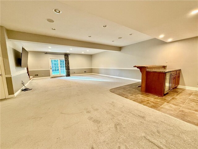 unfurnished living room with light colored carpet