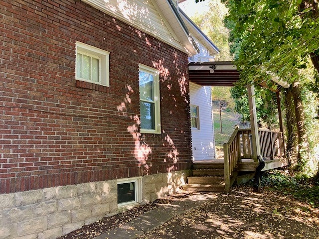 view of side of property with a deck