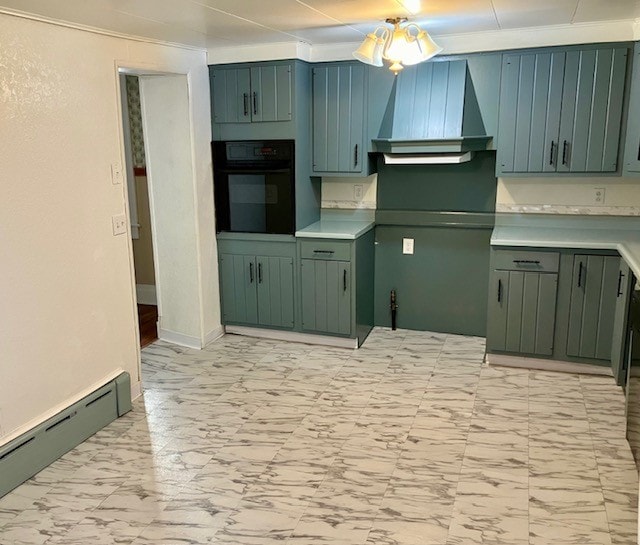 kitchen featuring oven, a baseboard radiator, green cabinetry, ceiling fan, and wall chimney exhaust hood