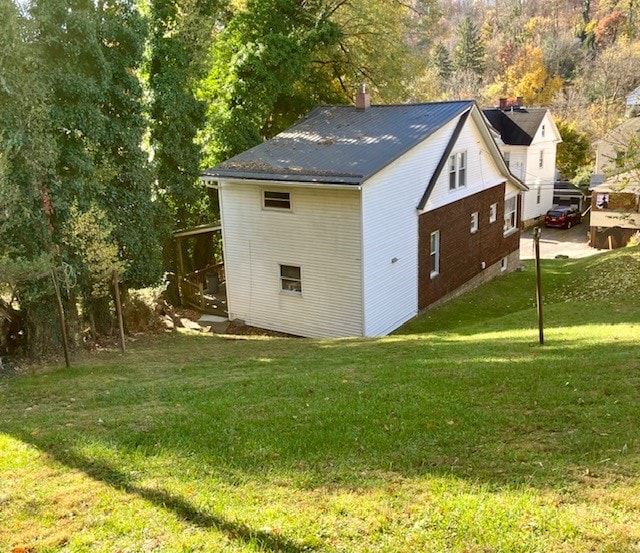 view of outdoor structure with a lawn