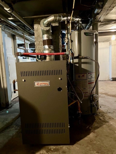 utility room featuring gas water heater