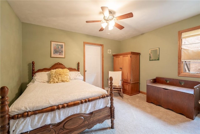 bedroom featuring ceiling fan and light carpet