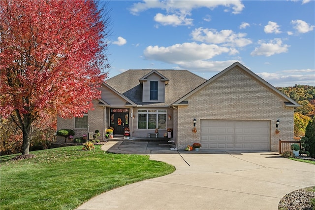 view of front of home featuring a front yard and a garage