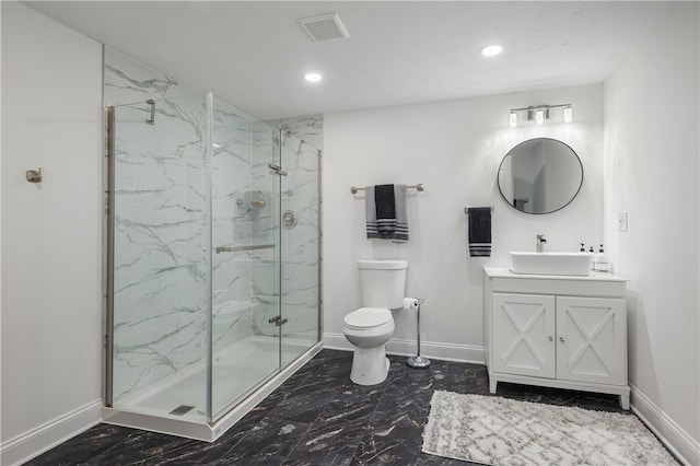 bathroom featuring vanity, toilet, and an enclosed shower