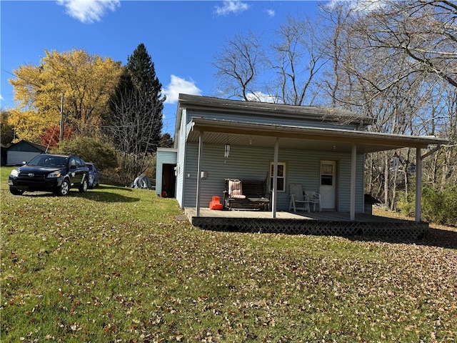 view of side of home with a lawn