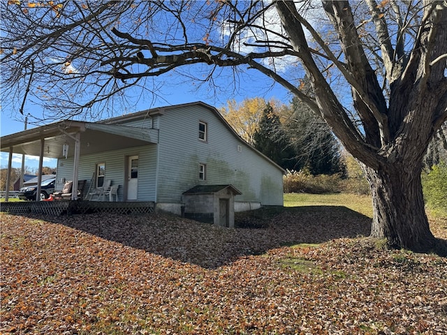 view of property exterior with a porch