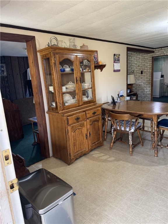 interior space with washer / dryer and ornamental molding