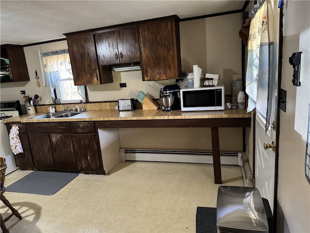 kitchen featuring crown molding, sink, dark brown cabinets, and white appliances