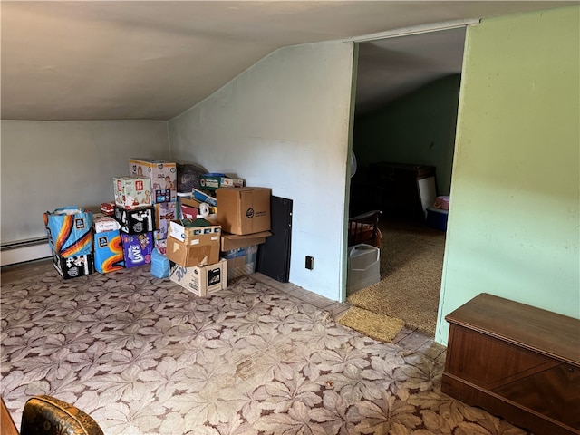 bonus room featuring light carpet, vaulted ceiling, and baseboard heating