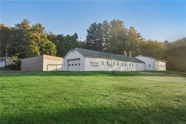 view of outbuilding with a yard