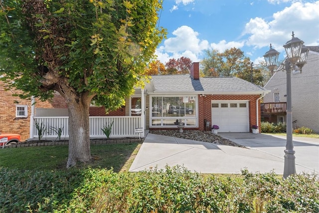 view of front facade with a garage and a front lawn