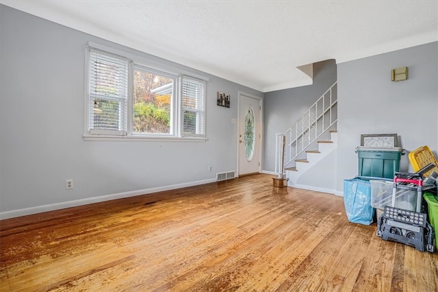 foyer with hardwood / wood-style floors