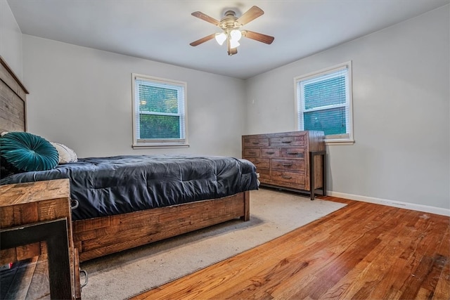 bedroom featuring ceiling fan and hardwood / wood-style flooring