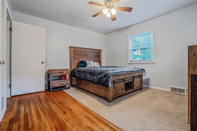 bedroom featuring hardwood / wood-style flooring and ceiling fan