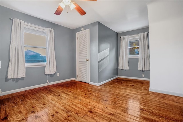 unfurnished room featuring ceiling fan and light hardwood / wood-style floors