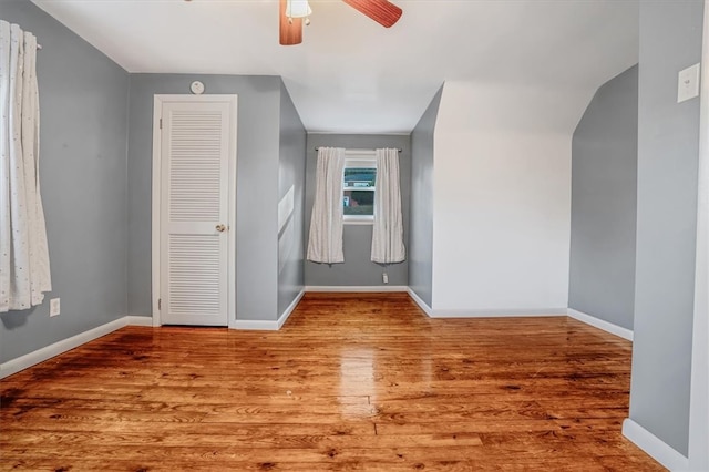 additional living space featuring ceiling fan and light hardwood / wood-style flooring