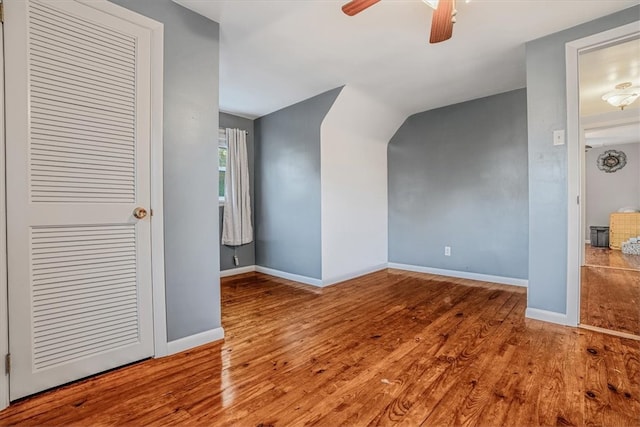 additional living space with wood-type flooring, ceiling fan, and lofted ceiling