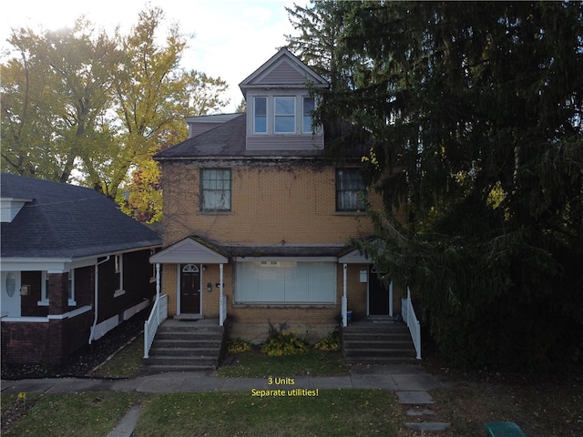 view of front of property featuring brick siding