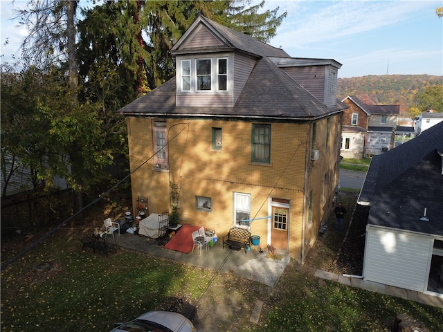 rear view of house with a patio