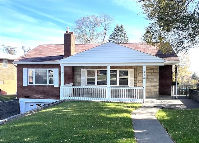 view of front of house featuring a front yard and a porch