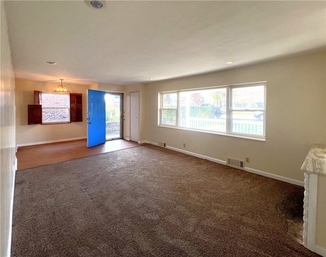 empty room featuring dark colored carpet