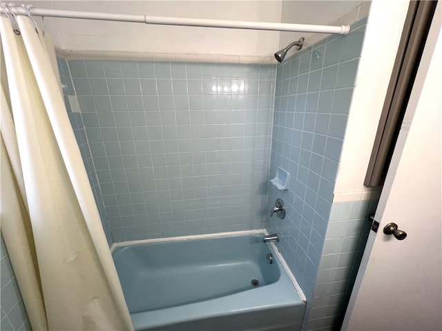 bathroom featuring shower / bathtub combination with curtain