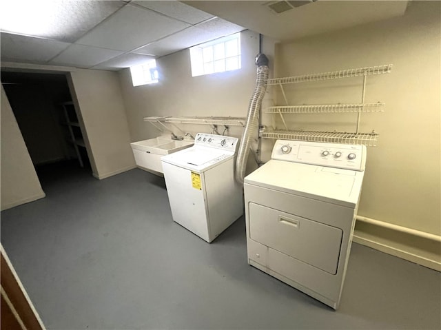 washroom featuring sink and separate washer and dryer