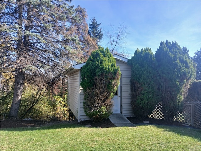 view of home's exterior with a yard