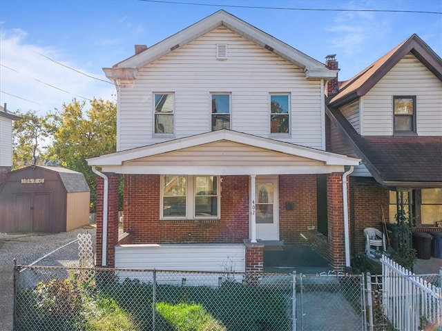 view of front of house featuring a shed