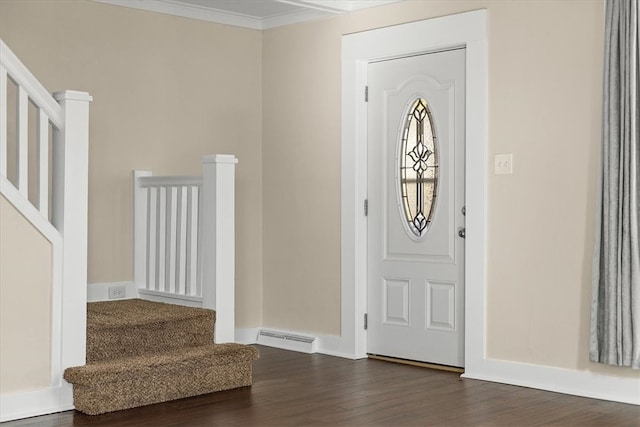 entrance foyer with ornamental molding and dark hardwood / wood-style flooring