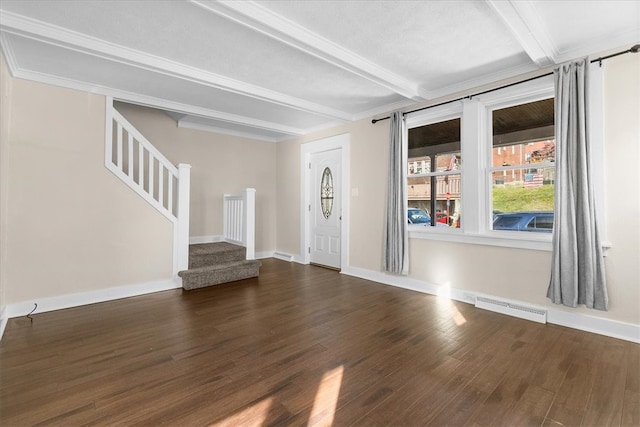 entryway with beamed ceiling and dark hardwood / wood-style flooring