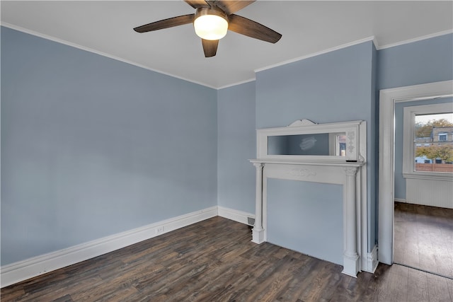 empty room featuring crown molding, dark hardwood / wood-style flooring, and ceiling fan