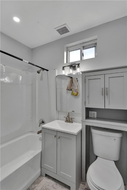 full bathroom featuring vanity, toilet, and  shower combination