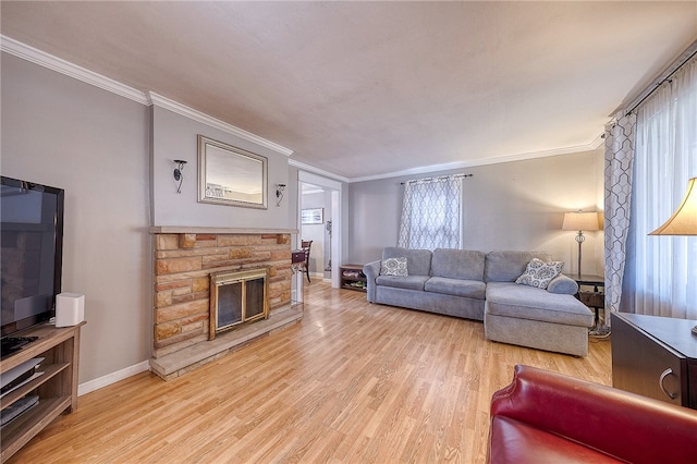 living room featuring light hardwood / wood-style flooring, ornamental molding, and a wealth of natural light