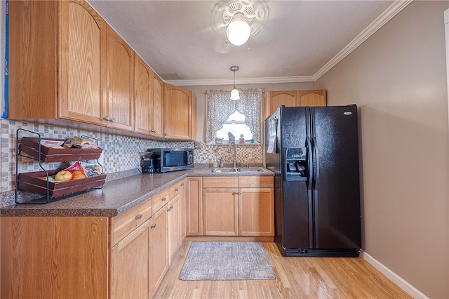 kitchen with light brown cabinets, backsplash, black fridge with ice dispenser, light hardwood / wood-style flooring, and ornamental molding