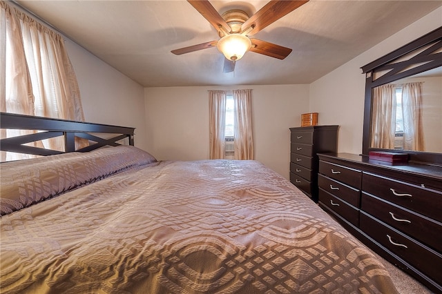 bedroom featuring carpet, multiple windows, and ceiling fan