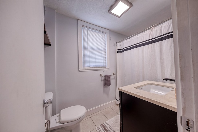 bathroom featuring a textured ceiling, toilet, vanity, a shower with shower curtain, and tile patterned flooring