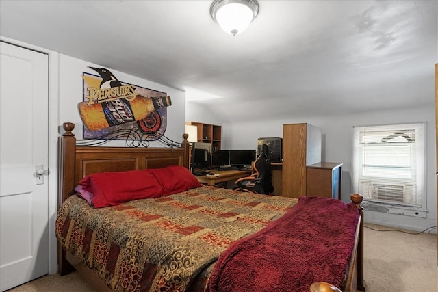 bedroom with light colored carpet and lofted ceiling