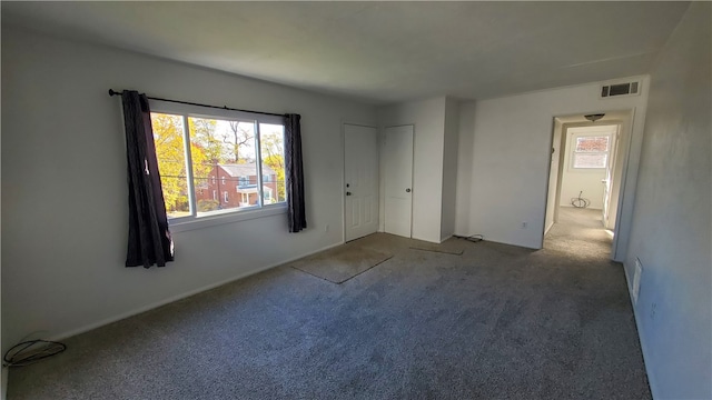 unfurnished bedroom with carpet flooring