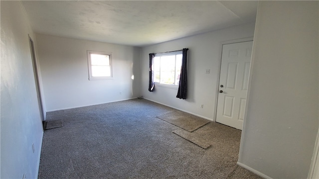 empty room featuring carpet flooring