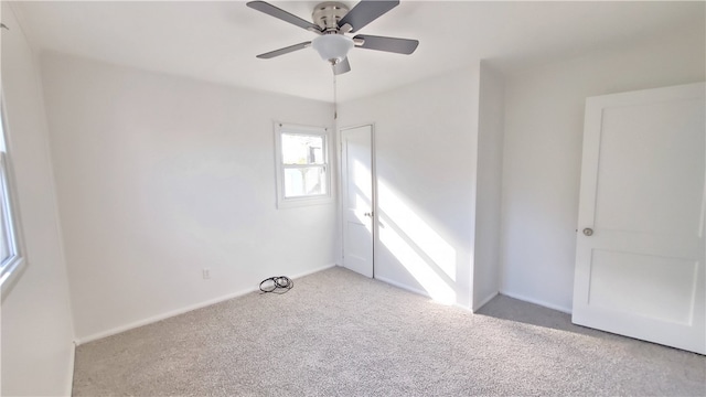 empty room featuring light carpet and ceiling fan