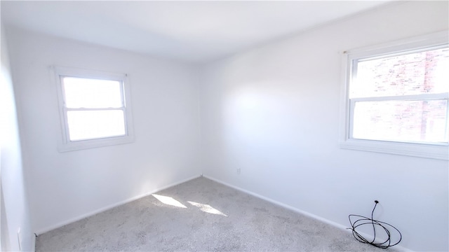 empty room featuring light colored carpet