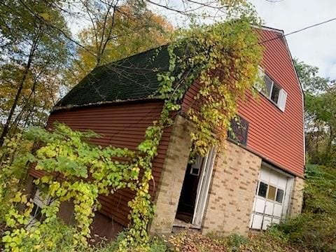 view of side of home with a garage