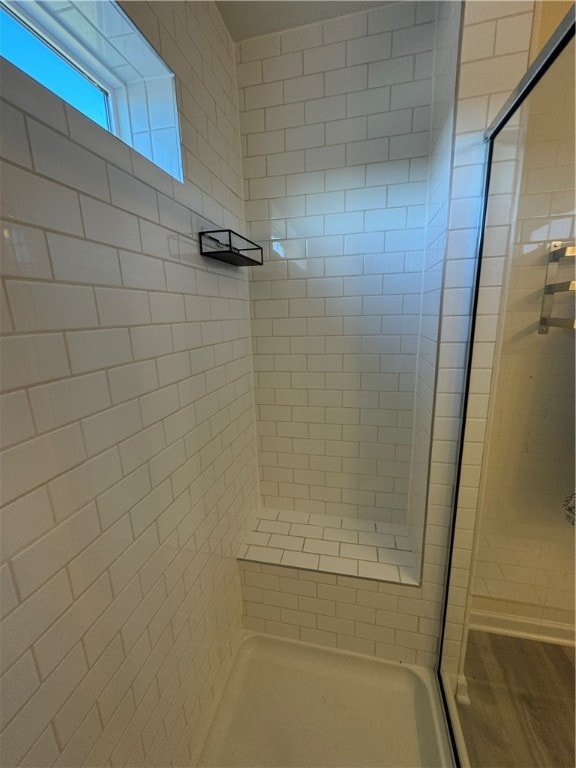 bathroom featuring tiled shower