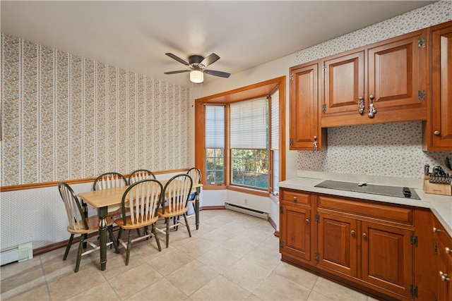 kitchen with a baseboard heating unit, ceiling fan, and black electric cooktop