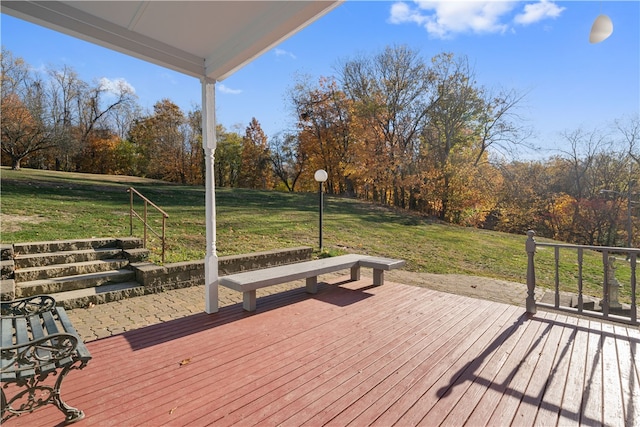 wooden deck featuring a yard