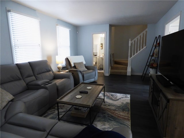 living room with dark hardwood / wood-style flooring