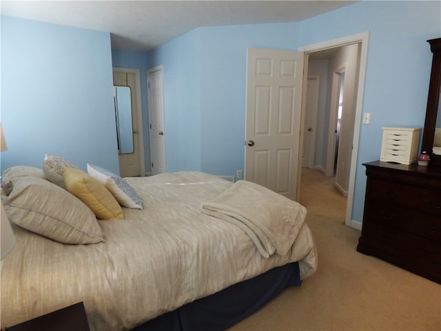 bedroom with light colored carpet