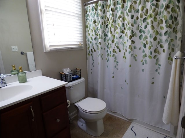 bathroom with a shower with shower curtain, vanity, toilet, and tile patterned flooring