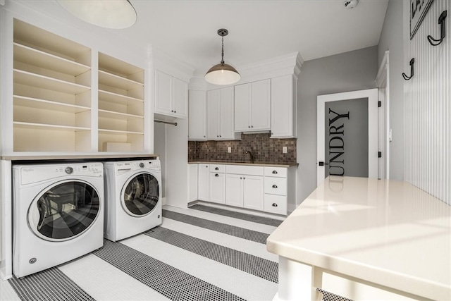 laundry area featuring independent washer and dryer and sink